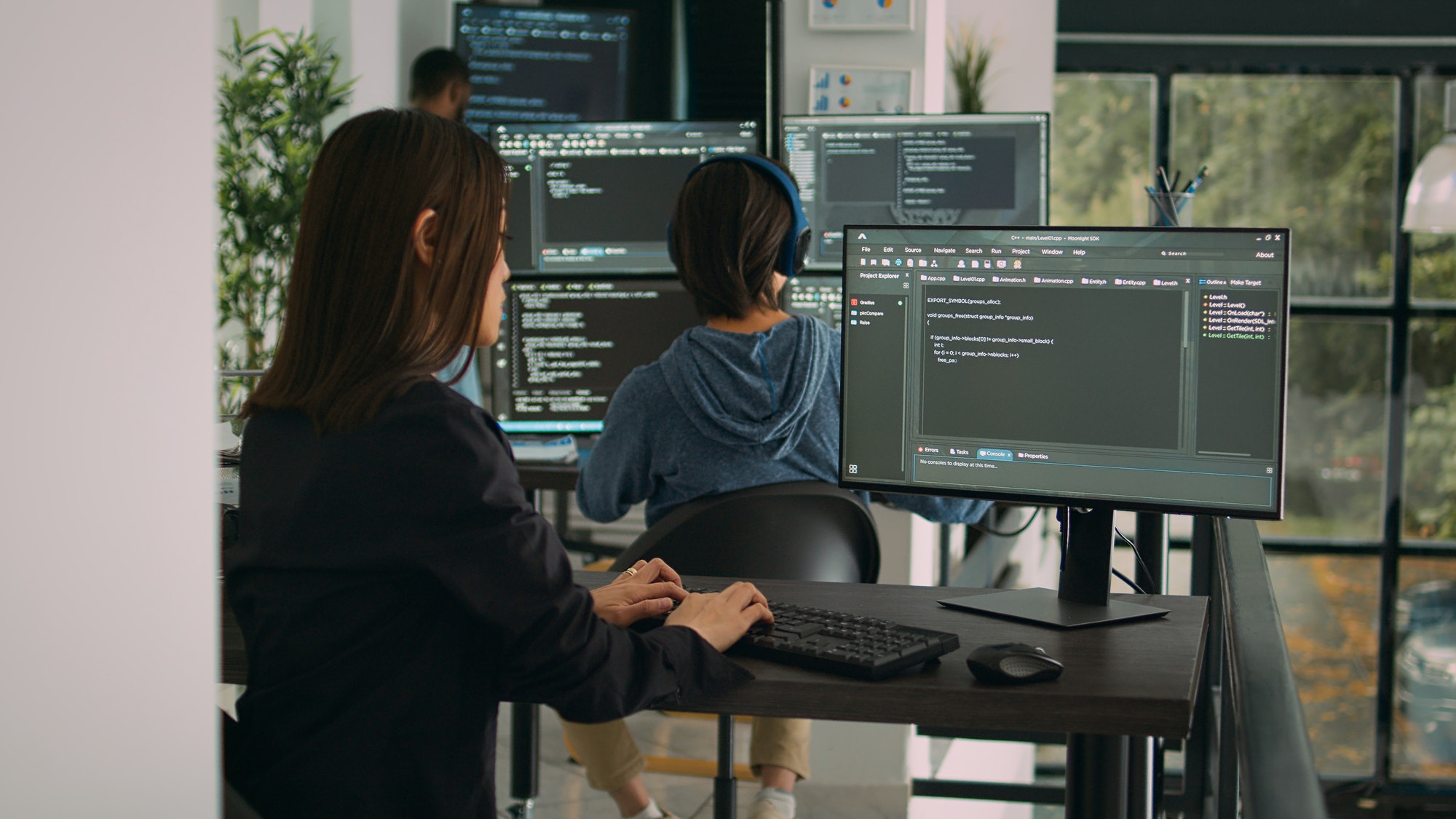 Database developer using computer to write code on terminal window